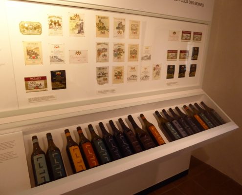 A collection of bottles and labels at the wine museum in Aigle.