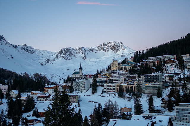 A view of Arosa in Switzerland in winter during sunset or sunrise.