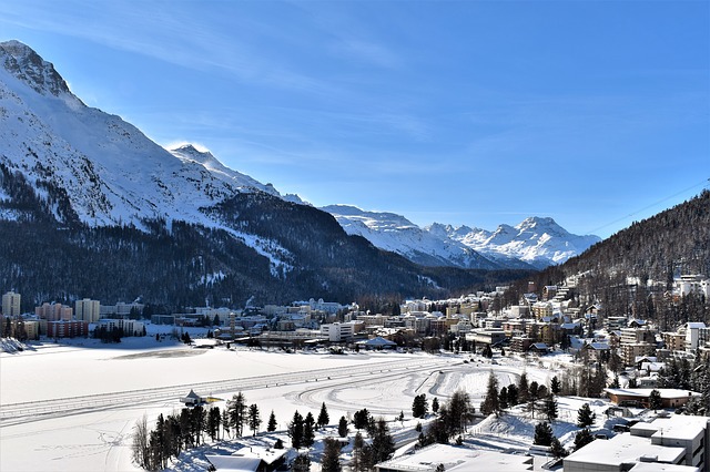 A view of St. Moritz and frozen Lake St. Moritz in the Upper Engadine valley in Switzerland in winter.